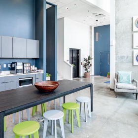 a community kitchen with a table and chairs