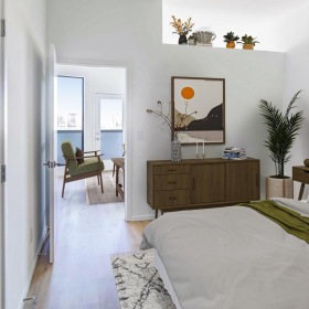 a bedroom with a bed and a chair